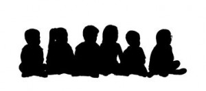 medium-group-children-seated-silhouette-preschool-row-floor-different-postures-front-view-44701010